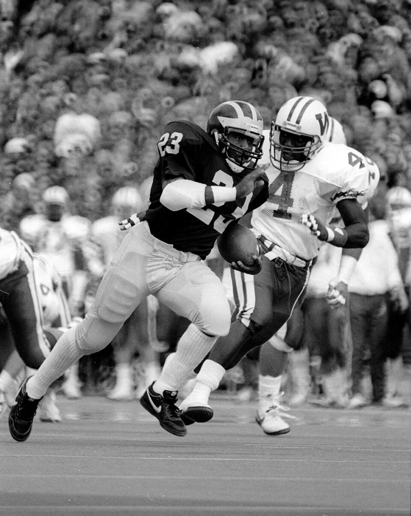 Black and white game action phooto of Michigan runner Jamie Morris, UM Football, vs Wis., 1987