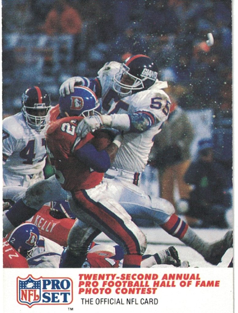 Color image of Jerry Pinkus 1989 of the NY Giants swallowing up a runner. 1990 Pro Set trading card 792