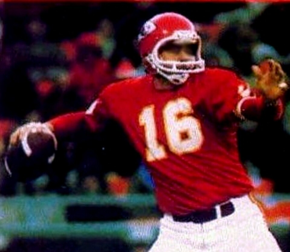 Full color image of Kansas City Chiefs quarterback Len Dawson pictured attempting a pass circa 1971.