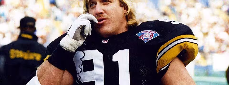 Color game day image of Kevin Greene talks to the Pittsburgh Steelers defensive coordinator during a game against the Miami Dolphins at Three Rivers Stadium on November 20th, 1994.