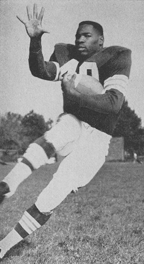Black and white promotional action pose of Bobby Mitchell in 1959 with the Browns.