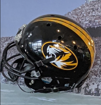 A full color black and yellow, Modern Mizzou fotball helmet, photo taken by Darin Hayes at AT&T Stadium, 2022