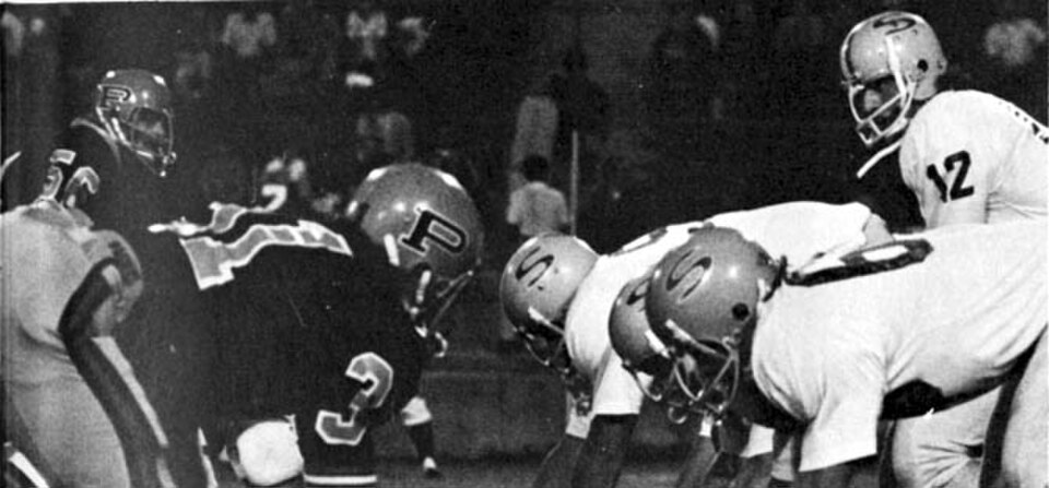 Black and white game action photo of Pacific Tigers football