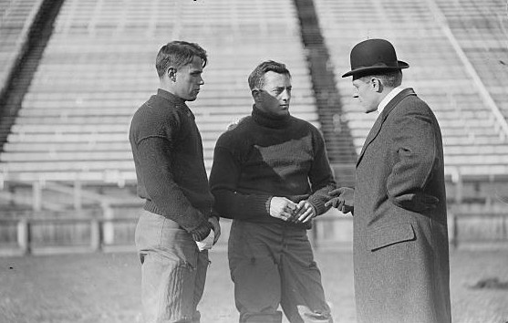 Vintage black and white image of Walter Logan (left), John Kilpatrick, Ralph Bloomer (right), Yale University, on field
