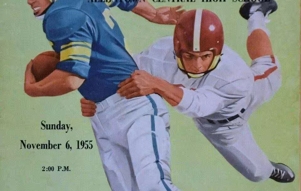 Full color artists rendering of an American football player in a blue jersey running with the ball avoiding a defender clad in white as part of Cover of a football program dated 1955.