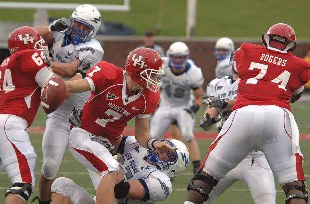 Full color game photo of The 2008 Houston Cougars football team faces off against the Air Force Falcons at Gerald J. Ford Stadium on the campus of Southern Methodist University. The game was originally intended to be a home game for the Cougars at Robertson Stadium, and was scheduled to be televised by CBS College Sports. Due to Hurricane Ike, the game was moved to Dallas, and the television appearance was cancelled.