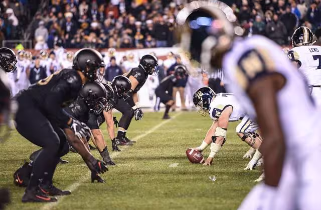 Full color image of The U.S. Military Academy West Point defensive line prepares for a play during the 119th Army-Navy Game in Philadelphia Dec. 8, 2018. The Army defeated the Navy for the third year in a row. (U.S. Army photo by Spc. Dana Clarke) www.dvidshub.net/