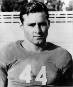 Black and white publicity photo of a helmetless Bill Wallace, in his Rice uniform jersey 44, circa 1934.