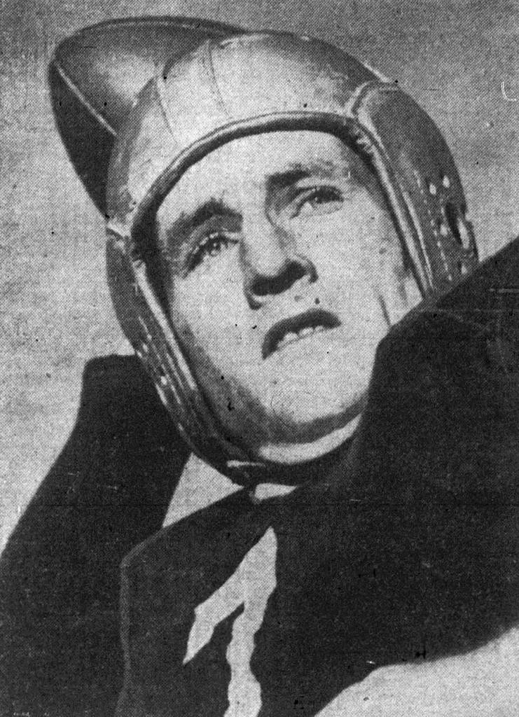 Black andwhite photo of American football player Bob Waterfield throwing.