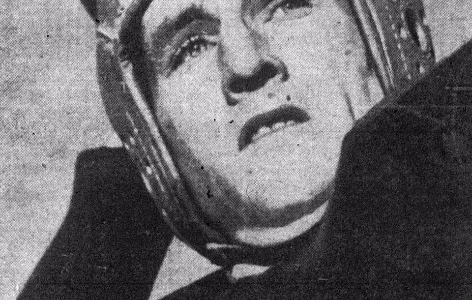 Black andwhite photo of American football player Bob Waterfield throwing.