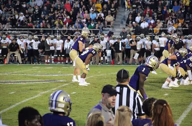 Full color photo of game action in Cartersville Hurricanes vs. Calhoun Yellowjackets, September 1, 2017 at Cartersville High School.