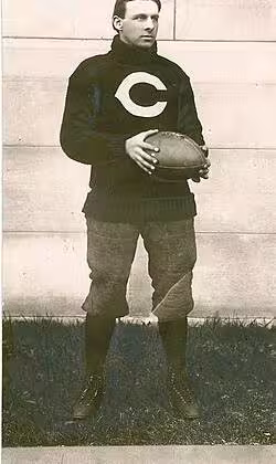 Vintage black \and white full body publicity photo of Clarence Bert Herschberger, in his University of Chicago uniform