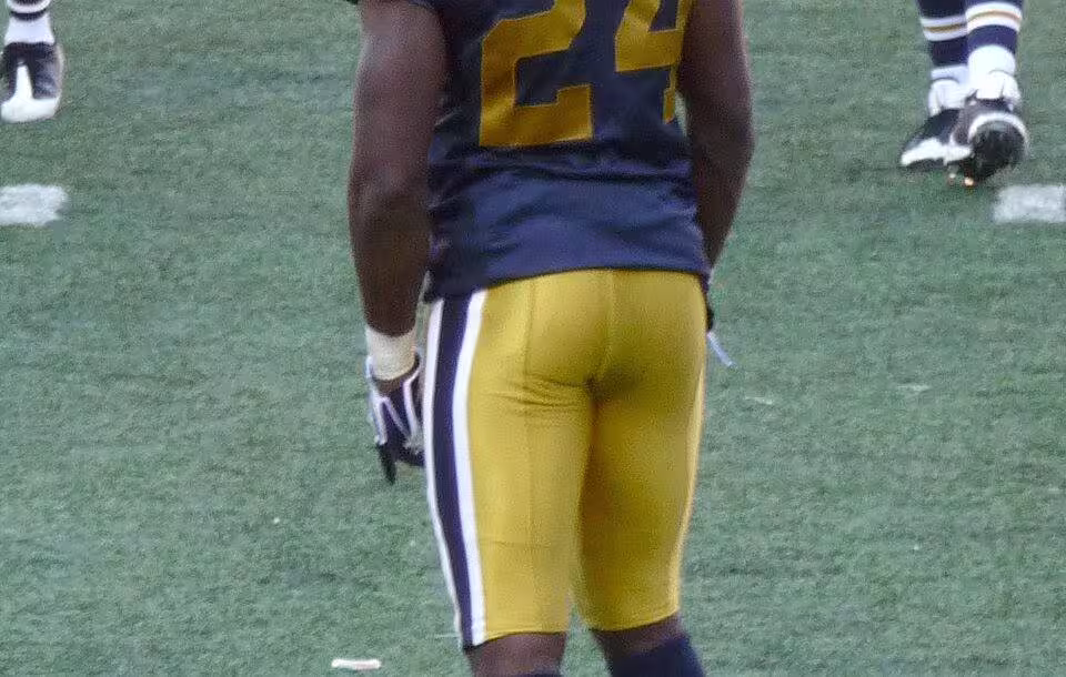 Full color photo image of Revis in 2008 wearing a NY Jets throwback uniform.
