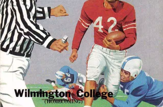 Full color artists rendering of an American football player in a red jersey running with the ball avoiding a defender clad in blue as part of Cover of a football program dated 1958.