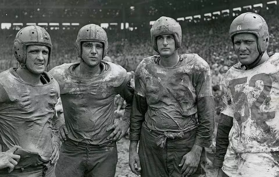 Four of Navy's Mudstained Stars Pose After the Army and Navy Football Game on the Fourth of July at Rizal Stadium, Manila, Philippines - NARA - 45697721.jpg Scope and content: Original Caption: Four of Navy's mudstained stars pose after the Army and Navy football game on the Fourth of July at Rizal Stadium, Manila, P.I. Left to Right: Geyer, Bloomfield, New Jersey; Hall, Chicago, Illinois; Horjes, Tacoma, Washington; Youngberg, Woodstock, Illinois.