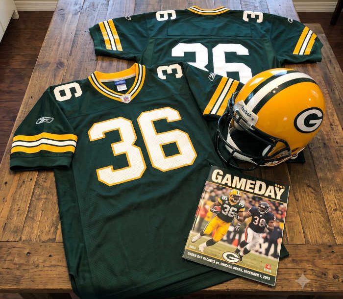 AI-generated green jersey 36 on a wooden table with a leather helmet and period example of a program