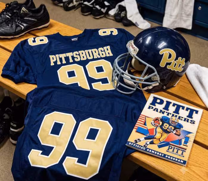 Gemini AI generated image of a 1980s-era blue American football jersey 99, without a name on it, and a matching period-correct helmet, the program cover appropriate to the era and team.