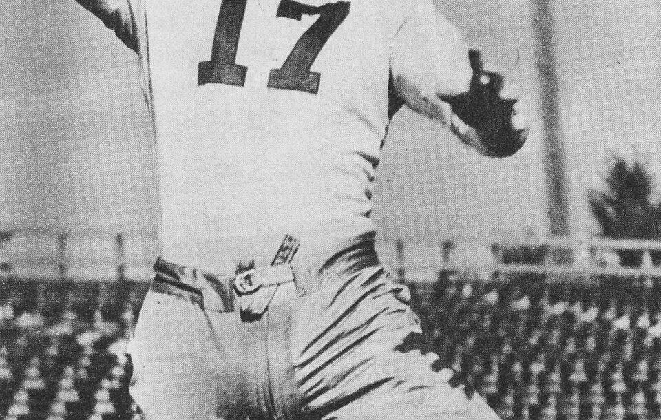 Black and white publicity football passing pose photo of Single-wing tailback Isbell set a new NFL record for passing in 1941, throwing for 1,479 yards.