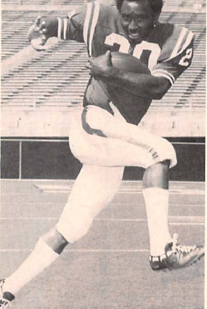 Black and white publicity photo of Rodgers in 1972 in uniiform (minus helmet) in a football running pose.