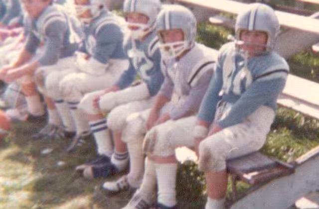 Color family photo of A photograph of players on a team in the Lincoln Village Middle School football league.