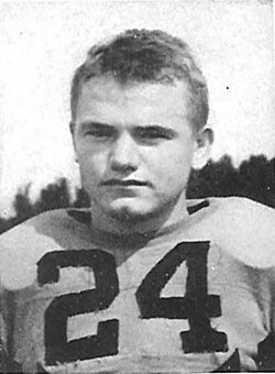 Publicty head shot on black and white of Nile Kinnick 1939 in Iowa uniform with helmet off