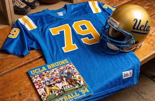 Gemini AI generated image of a 1990s-era blue American football jersey 79, without a name on it, and a matching period-correct helmet, the program cover appropriate to the era and team.