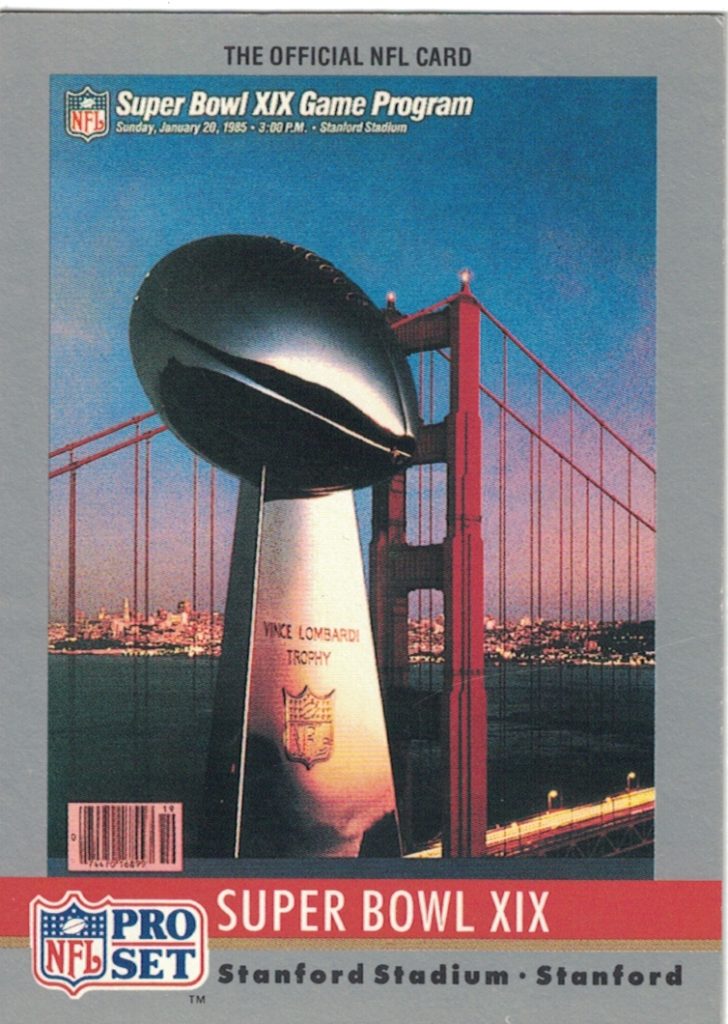full color trading Pro Set card of Super Bowl XIX program cover featuring the Lombardi Trophy over the back drop of the Golden Gate Bridge.