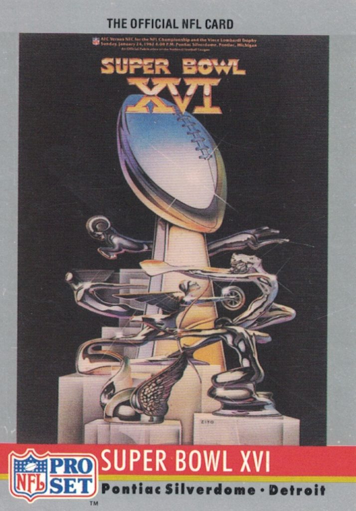 Full color Pro Set Card of Super Bowl XVI. Lombardi Trophy with US Automobile hood ornaments intertwined in it.