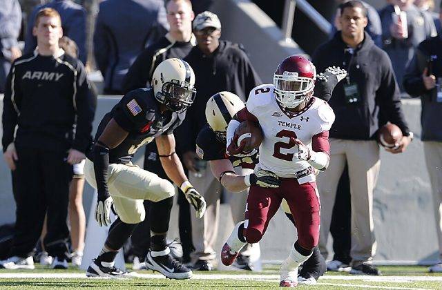 Full color game action photo of Temple Owls running back Matt Brown (2) breaks away from from a Army Black Knights defender during the NCAA Division 1football game between Temple Owls and the Army Black Knight, Nov. 17, at Michie Stadium, West Point, New York.