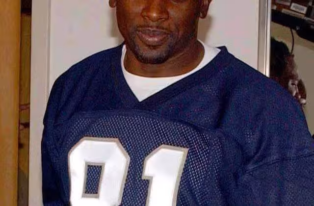 Full color photo of Tampa Bay Buccaneers wide receiver Tim Brown Photographer's Mate 1st Class Aviation Warfare Systems Operator Toiete Jackson