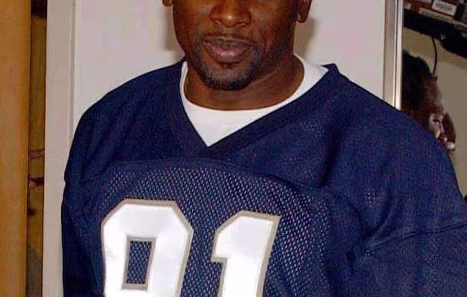 Full color photo of Tampa Bay Buccaneers wide receiver Tim Brown Photographer's Mate 1st Class Aviation Warfare Systems Operator Toiete Jackson