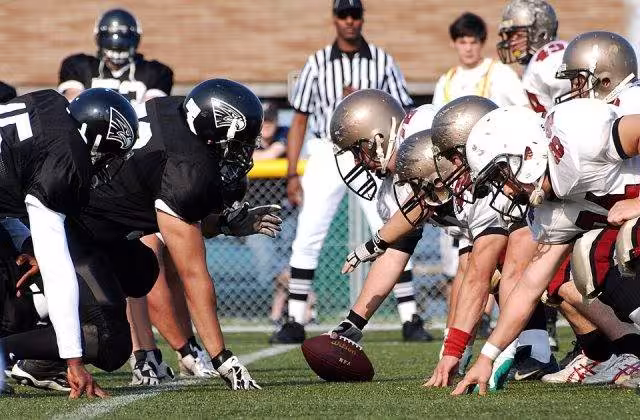 Color photo down the line of scimmage of US Navy 090608-N-3283P-018 The Yokosuka Seahawks face off against the Yokohama Harbors during the U.S. Forces Japan-American Football league at Yokosuka Field.jpg
