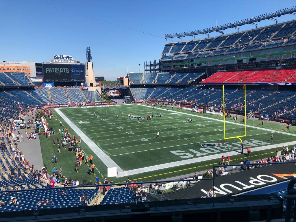 Full color inside stadium view photo of Gillette Stadium before the Jets-Patriots game 2019-2020, courtesy of Photo by Natan Macoul on Unsplash