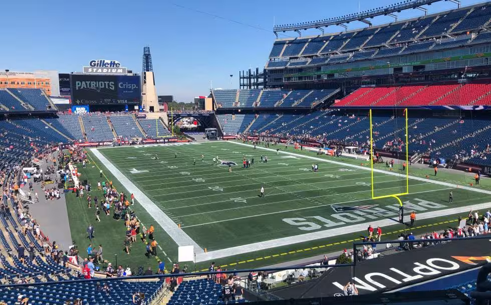 Full color inside stadium view photo of Gillette Stadium before the Jets-Patriots game 2019-2020, courtesy of Photo by Natan Macoul on Unsplash