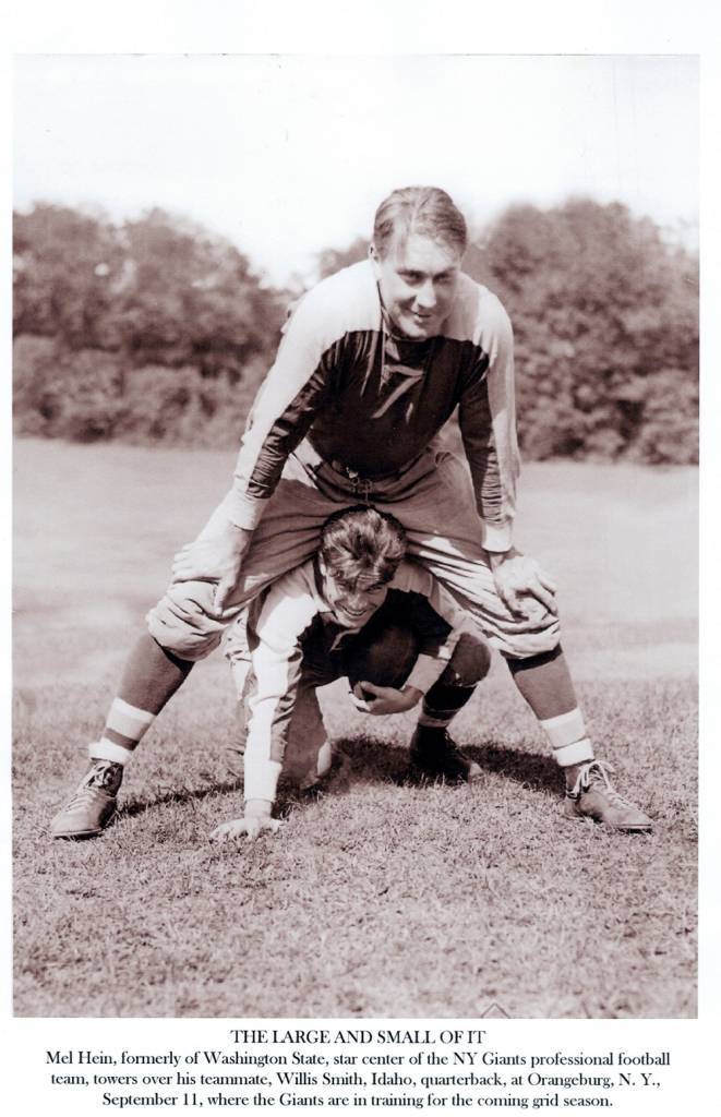 Vintage black and white image of Mel Hein (Number 7) over top Willis Smith at the New York Giant preseason camp in 1935. Courtesy of Larry Schmitt's collection.