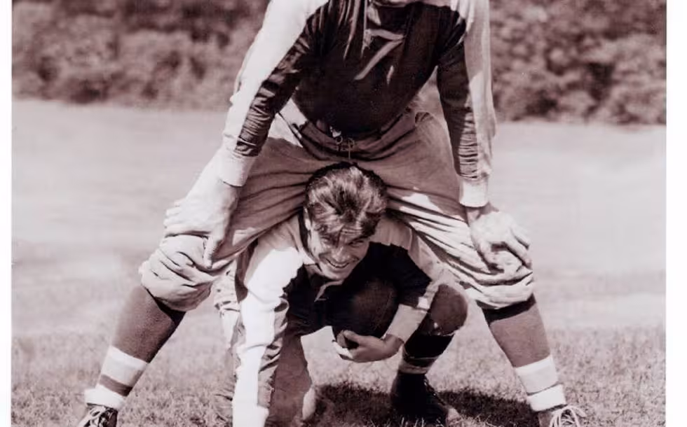 Vintage black and white image of Mel Hein (Number 7) over top Willis Smith at the New York Giant preseason camp in 1935. Courtesy of Larry Schmitt's collection.