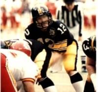 Bradshaw playing with the Steelers in 1982. Courtesy of a kind Wikimedia Commons uploader as part of the Pittsburgh Steelers/Coca-Cola/Kiwanis International - "1983 Steelers Police - 04 Terry Bradshaw". Pittsburgh Steelers/Coca-Cola/Kiwanis International. 1983. Pittsburgh Steelers quarterback Terry Bradshaw preparing for an offensive play against the Kansas City Chiefs during a December 5, 1982 home game at Three Rivers Stadium.