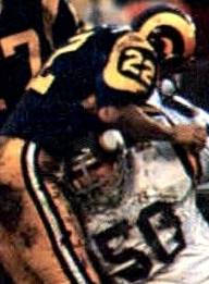 John Cappelletti Number 22 of the Rams in 1977 - By Jeno's - "1986 Jeno's Pizza - #18 Alan Page". Jeno's. 1986., Public Domain, https://commons.wikimedia.org/w/index.php?curid=90723486