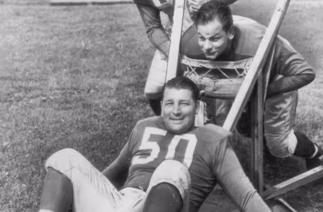 black and white photo of Alex Wojciechowicz (50), Emil Uremovich, Frank Szymanski 1946 at Lions practice.
