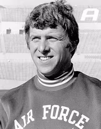 US Air Force - https://www.si.com/college-football/photos/2012/09/05ncaas-top-real-animal-mascots/9 Air Force Academy football coach Bill Parcells poses with mascot Mach 1 the falcon.