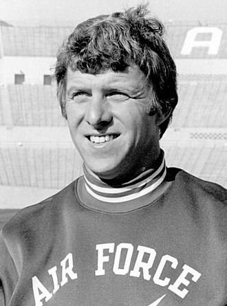 US Air Force - https://www.si.com/college-football/photos/2012/09/05ncaas-top-real-animal-mascots/9 Air Force Academy football coach Bill Parcells poses with mascot Mach 1 the falcon.