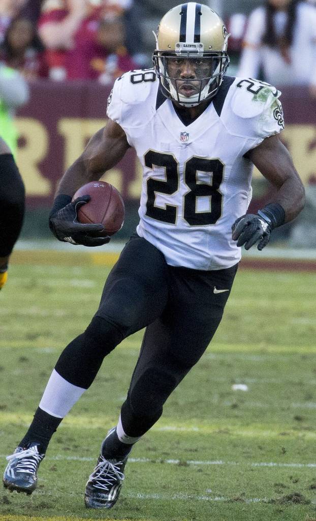 Color game action shot of CJ Spiller running as the Saints played at Redskins 11/15/15, By Keith Allison - Flickr.