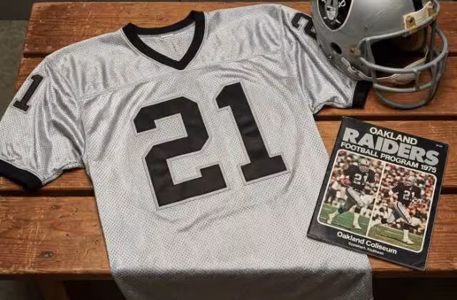 Gemini AI generated image of a 1970s-era white American football jersey 21, without a name on it, and a matching period-correct helmet, the program cover appropriate to the era and team.