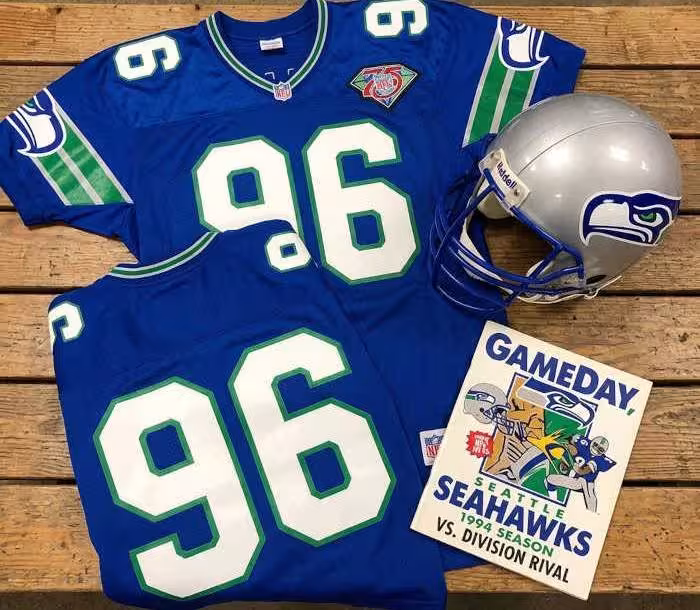 Gemini AI created image of a 1994-era Seattle NFLy American football jersey 96, without a name on it, and a matching period-correct helmet, the program cover appropriate to the era and team.