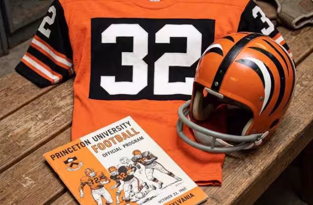 image of a 1965-era Princeton University American football jersey 32, without a name on it, and a matching period-correct helmet, the program cover appropriate to the era and team.