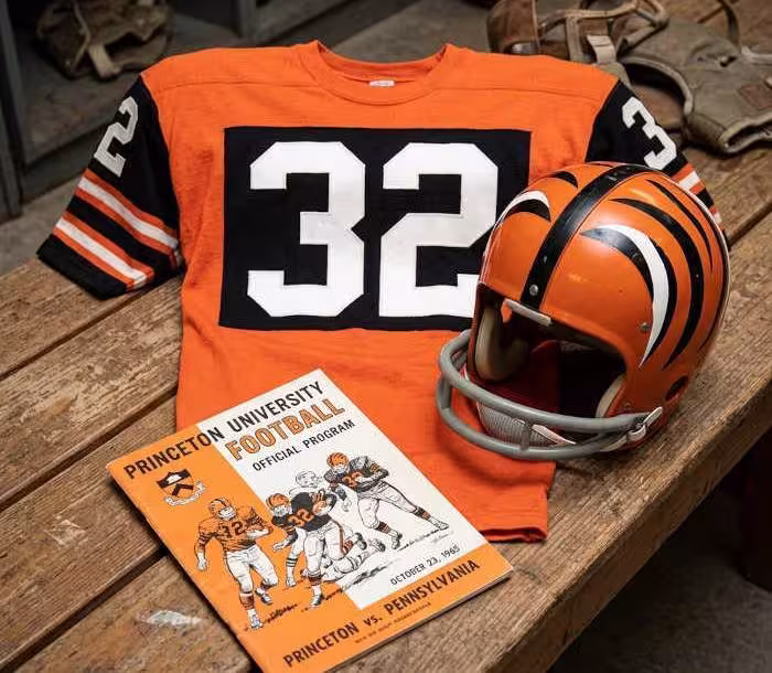 image of a 1965-era Princeton University American football jersey 32, without a name on it, and a matching period-correct helmet, the program cover appropriate to the era and team.
