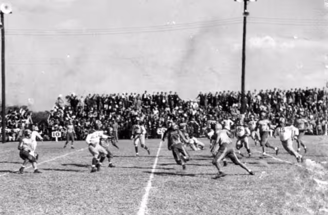 Black and white game action photo of Florida A & M Rattler's football game: Tallahassee, Florida Date: ca. 1940