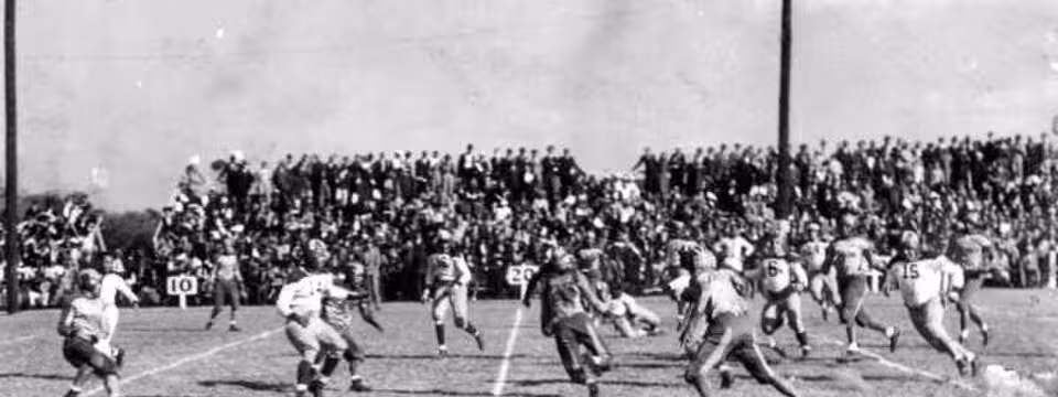 Black and white game action photo of Florida A & M Rattler's football game: Tallahassee, Florida Date: ca. 1940