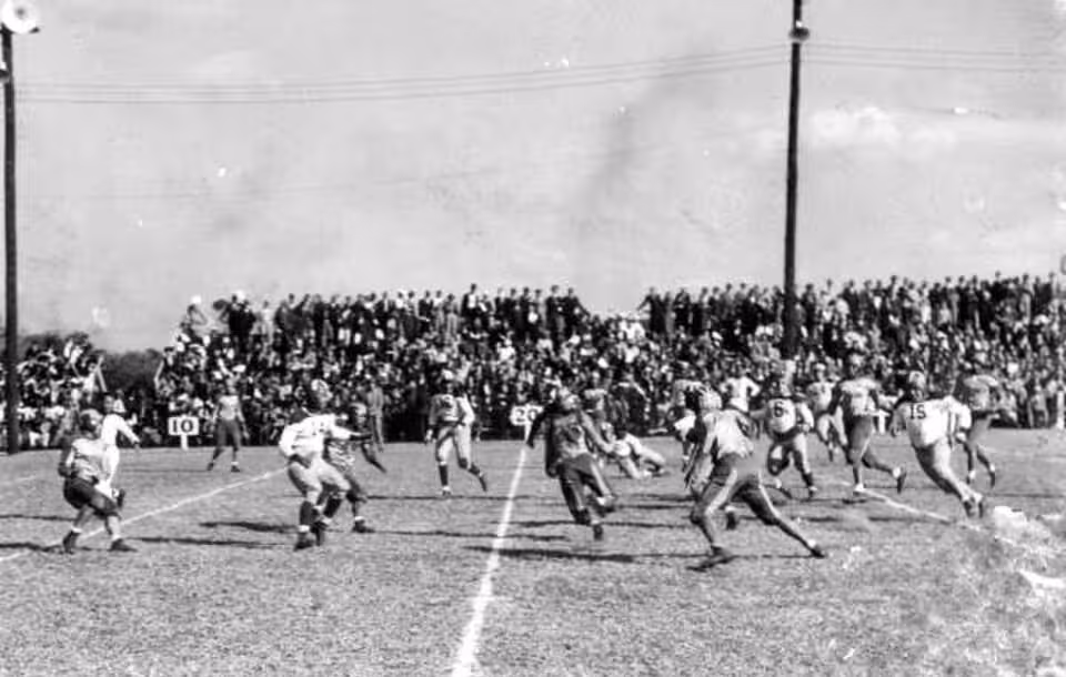 Black and white game action photo of Florida A & M Rattler's football game: Tallahassee, Florida Date: ca. 1940