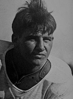Vintage black and white publicity head shot of Jerry Dalrymple Unknown photographer - courtesy of Wikimedia Commpns and the College Football Hall of Fame under Fair Use.